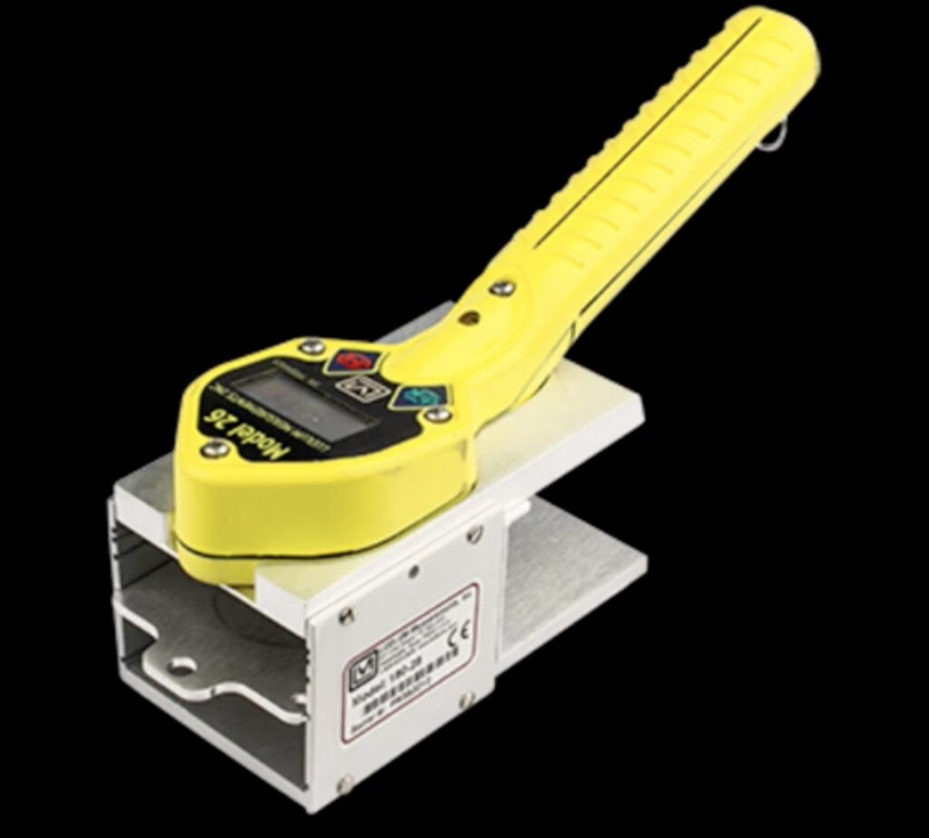 Frisker with integrated geiger mueller pancake from Ludlum, model 26-1 with black background